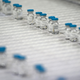 This picture taken on April 22, 2021, in Poce-sur-Cisse, France, shows bottles of diluent on the production line inside the pharmaceutical plant Fareva, which were planned to be used for the CureVac vaccine.